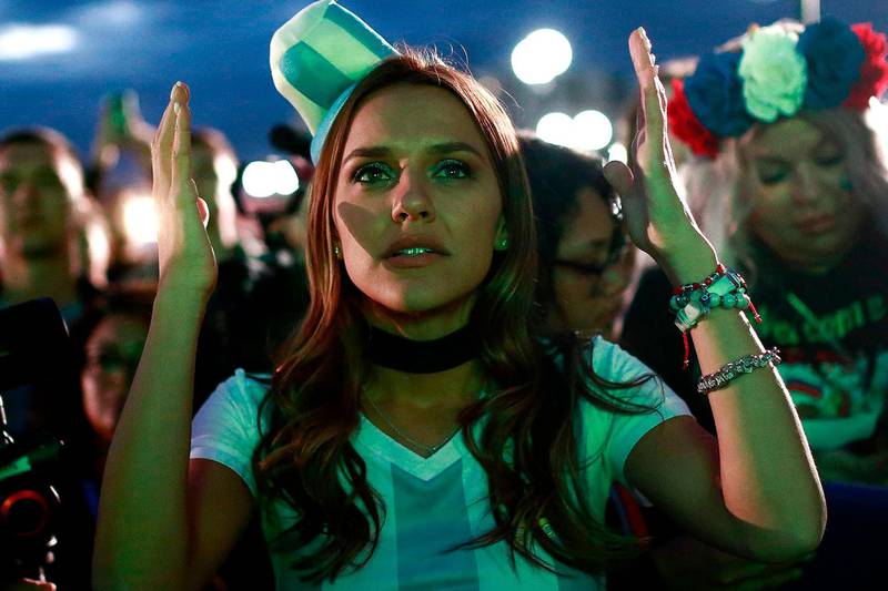 TOPSHOT - An Argentina fan at the Fan Zone in Kazan reacts as she watches a live broadcast of the Russia 2018 World Cup football match between Argentina and Croatia.  Benjamin Cremel / AFP