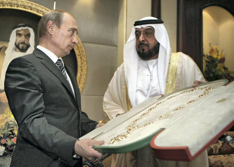 Sheikh Khalifa bin Zayed Al Nahayan (R) presents the country's highest award, the Zayed Order, to Russian President Vladimir Putin (L) at the Mushrif Palace in Abu Dhabi. Putin is accompanied on the trip by the director of arms exporter Rosoboronexport, as well as those of the airline Aeroflot and space agency Roskosmos.        RIA NOVOSTI / KREMLIN POOL / DMITRY ASTAKHOV / AFP PHOTO / POOL / DMITRY ASTAKHOV