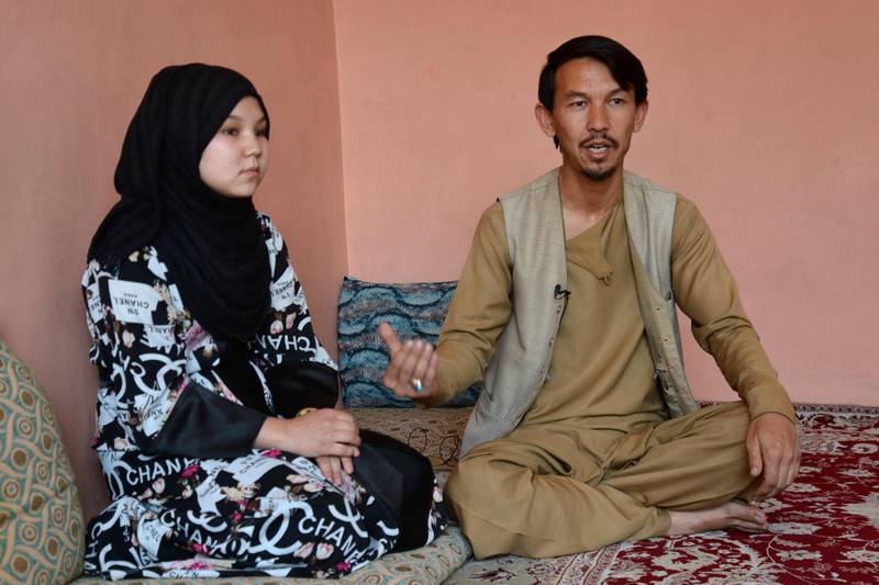 Mohammed Anwar Nazari and his daughter Alina give an interview. Even if schools do reopen fully, barriers to girls returning to education remain, with many families suspicious of the Taliban and reluctant to allow their daughters outside.