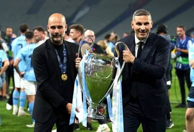 Manchester City manager Pep Guardiola, left and chairman Khaldoon Al Mubarak celebrate with the trophy after City's 1-0 victory over Inter Milan in the Champions League final at the Ataturk Olympic Stadium, Istanbul. PA 