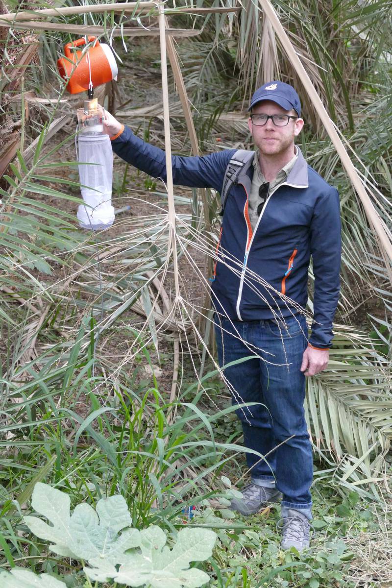 Dr Jeremy Camp with the mosquito traps that were used to collect the creatures at Al Ain Oasis. Photo by Norbert Nowotny NOTE: For Daniel Bardsley's story about mosquito species found in the UAE