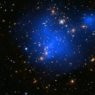 Galaxy clusters are the largest objects in the universe held together by gravity. They contain enormous amounts of superheated gas, with temperatures of tens of millions of degrees, which glow brightly in X-rays and can be observed across millions of light years between galaxies.
