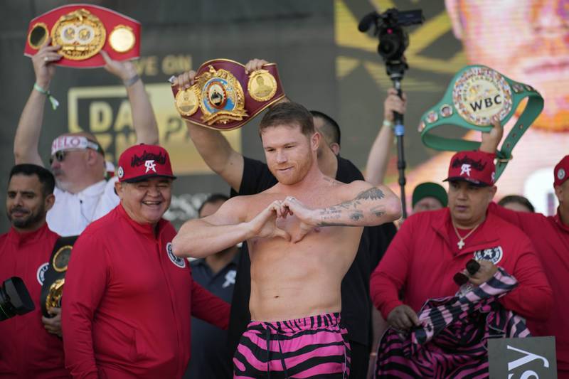 Sauk Alvarez motions to the crowd during the weigh-in for his fight with Dmitry Bivol. AP