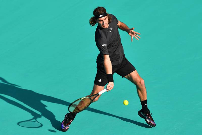 Stefanos Tsitsipas hots a forehand to Andrey Rublev during the Mubadala World Tennis Championship final in Abu Dhabi on December 18, 2022. AFP