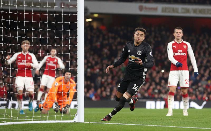 Manchester United's Jesse Lingard, second left, scores his side's third goal of the game against Arsenal during the English Premier League soccer match at the Emirates Stadium, London, Saturday Dec. 2, 2017. (Adam Davy/PA via AP)