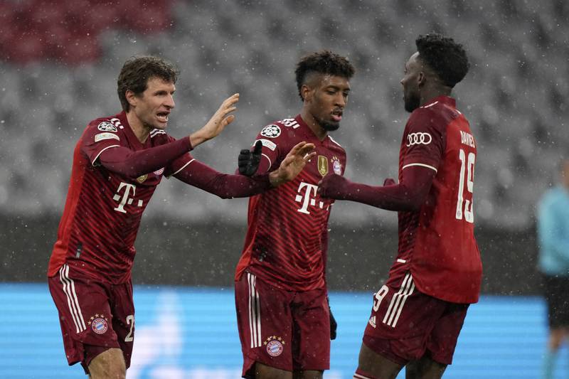Bayern's Thomas Muller, left, reacts with teammates after scoring the opening goal in the 3-0 win against Barcelona. AP
