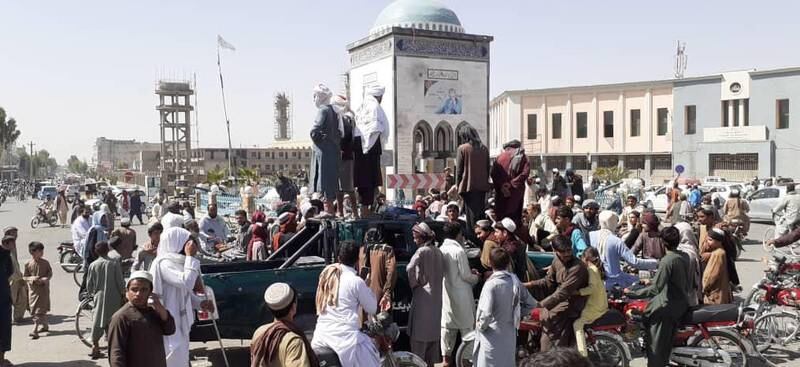 Taliban militants gather in the main square after taking control of Kandahar, Afghanistan, on August 13, 2021.  The fall of Kandahar came hours after the Taliban had captured Herat. EPA