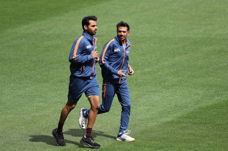 Yuzvendra Chahal and Bhuvneshwar Kumar run before the start of a practice session. AFP