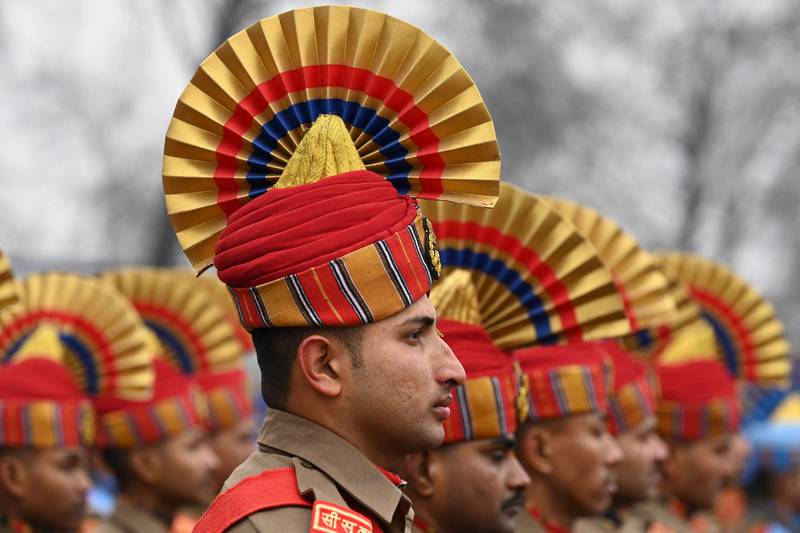 Indian security personnel march during a Republic Day parade at a stadium in Srinagar on January 26, 2023.  (Photo by TAUSEEF MUSTAFA  /  AFP)