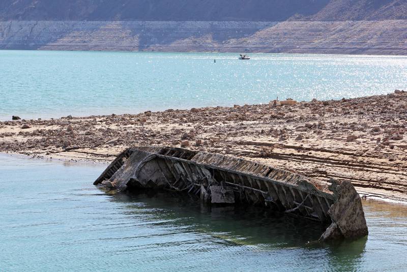 A sunken Second World War-era Higgins landing craft that used to be nearly 61 metres underwater is revealed near the Lake Mead Marina in the US state of Nevada as the waterline continues to fall. AFP