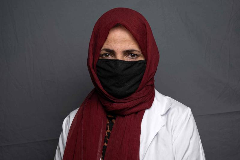 Doctor and mental health counsellor Mursal, 35, poses for a portrait at an undisclosed location in Afghanistan. Since their takeover a year ago, the Taliban have squeezed Afghan women out of public life, imposing suffocating restrictions on where they can work, how they can travel and what they can wear.