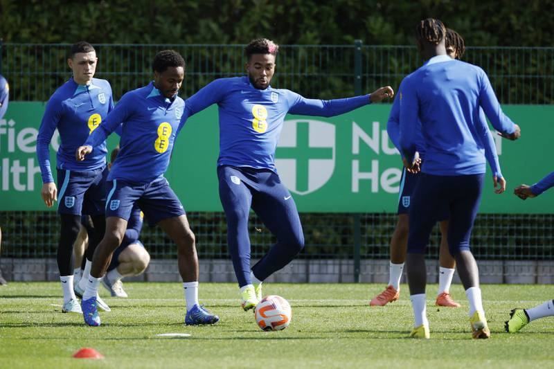 England's Raheem Sterling and Reece James with teammates during training. Reuters