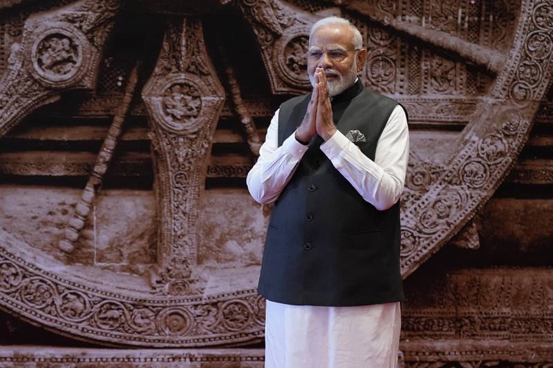 A greeting from Indian Prime Minister Narendra Modi as he waits on the leaders of the G20 countries, in New Delhi, India, on September  9, 2023. AP