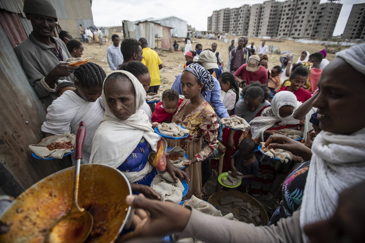 Displaced Tigrayans wait for food donated by local residents at a reception centre for the internally displaced in Mekele, in the Tigray region of northern Ethiopia. AP Photo