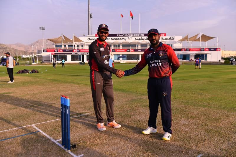 UAE cricket captain CP Rizwan, left, shakes hands with his Kuwaiti counterpart in Muscat ahead of their 2022 Asia Cup Qualifier. Photo: ACC