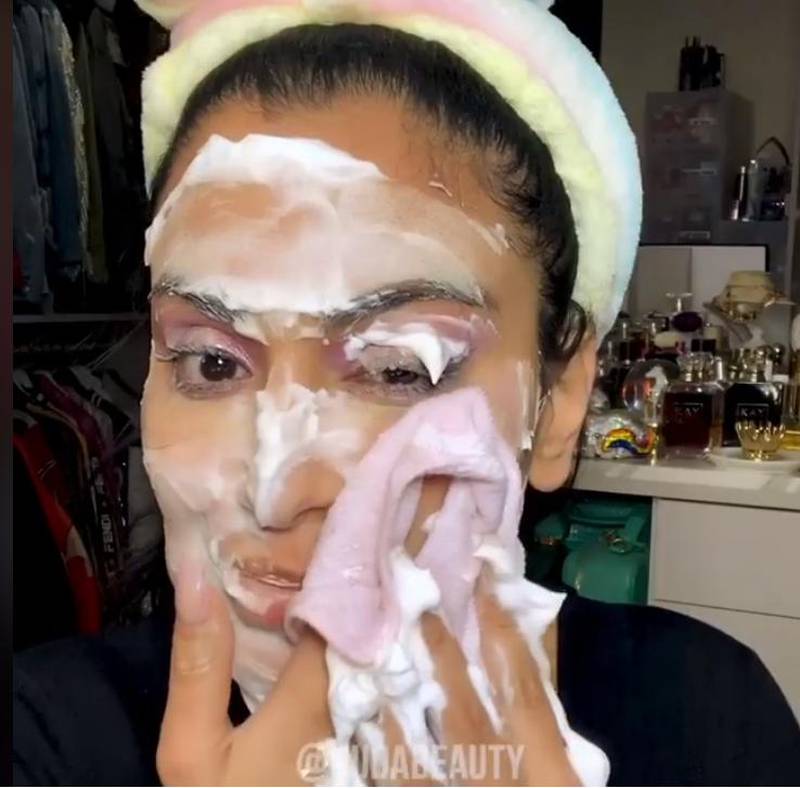 Huda Kattan uses shaving foam all over her face to remove make-up. Facebook / Huda Beauty 