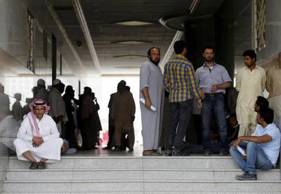 Migrant workers, who work for Saudi Binladin Group, gather as they ask for a final settlement over a salary issue, in Riyadh on March 29, 2016. Faisal Al Nasser / Reuters