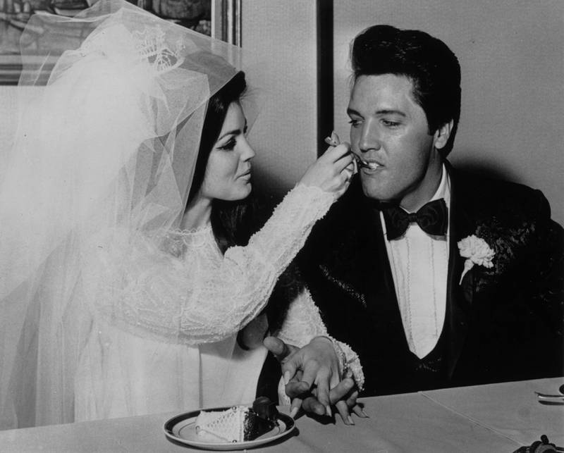 Priscilla Presley feeds Elvis wedding cake at the Aladdin Hotel, Las Vegas, in 1967