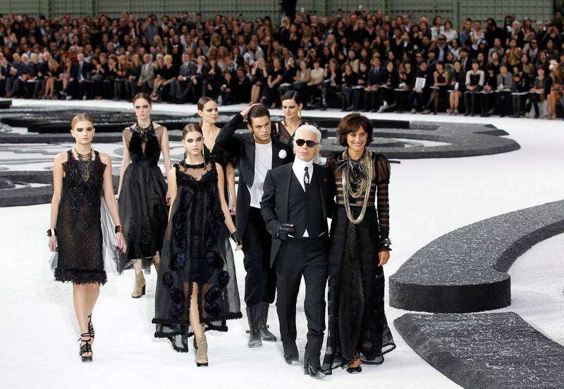 Clad in dramatic black, Lagerfeld walks the runway with Lily Donaldson, Coco Rocha, Freja Beha, Stella Tennant and one-time muse Ines de la Fressange for spring / summer 2011. EPA