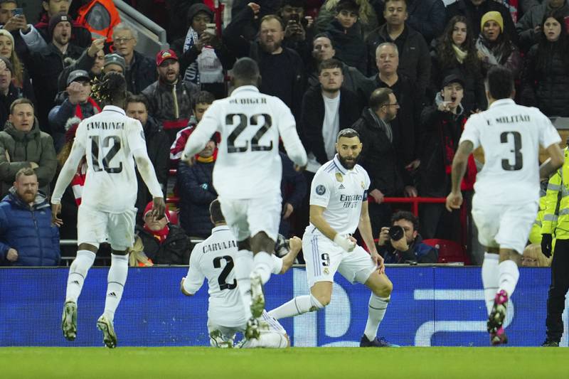 Karim Benzema, second right, celebrates after scoring Real's fourth goal. AP