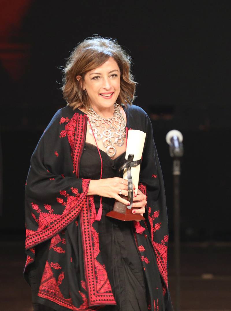 Palestinian director Najwa Najjar won Naguib Mahfouz Award for Best Screenplay during the closing ceremony of the 41st Cairo International Film Festival. EPA