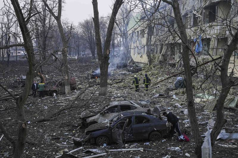 Ukrainian emergency employees work at a maternity hospital damaged by shelling in Mariupol. AP Photo