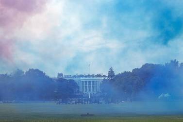 Red and blue smoke fill the air after cannons were fired during the Salute to America event in Washington, D.C., U.S., on Saturday, July 4, 2020. President Donald Trump yesterday decried what he described as efforts to eliminate U.S. history and malign heroes, lashing out at those protesting symbols they say celebrate racial injustice as he stoked culture wars over history and education. Photographer: Stefani Reynolds/CNP/Bloomberg