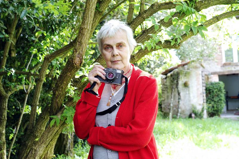 Marie-Laure de Decker poses with her Leica M4 camera. AFP