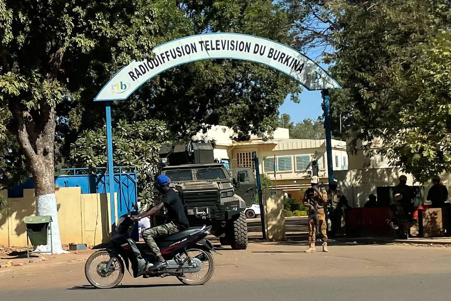 Burkina Faso soldiers outside the National TV centre in Ouagadougou. Mutinous troops in Burkina Faso arrested and detained President Roch Marc Christian Kabore and his ministers on Monday, demanding more resources for the battle against extremists. AFP
