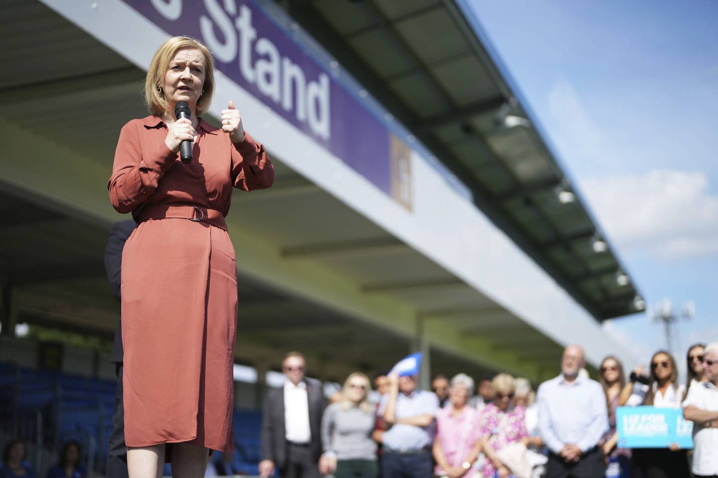 Liz Truss speaks at a football ground in Solihull, England, at a campaign stop on Saturday. AP 