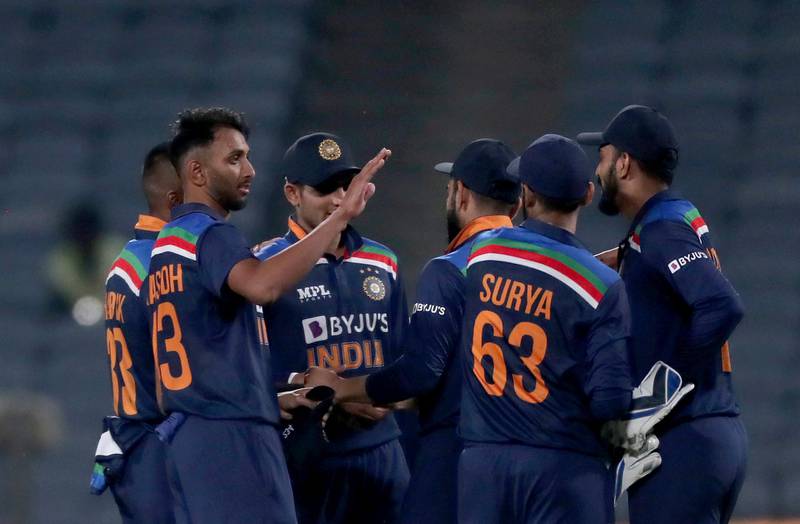 India's Prasidh Krishna, second left, and teammates celebrate their win in the first ODI against England in Pune. AP