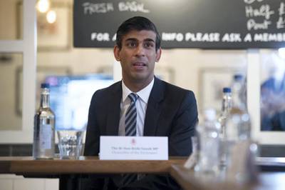 Britain's Chancellor of the Exchequer Rishi Sunak hosts a roundtable meeting for business representatives at a branch of the Franco Manca chain pizza restaurant in London on October 22, 2020.  The Chancellor announced on October 22 a new support package for businesses affected by Tier 2 coronavirus restrictions, the 'high' alert level which effects places like London and Birmingham, which include subsidies for pubs and restaurants.  / AFP / POOL / Stefan Rousseau

