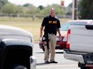 US police have not identified the white male who hijacked a post van before shooting at passers-by. AP