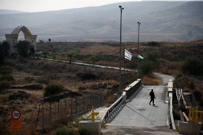 An Israeli soldier patrols the border area between Israel and Jordan at Naharayim, as seen from the Israeli side. Reuters