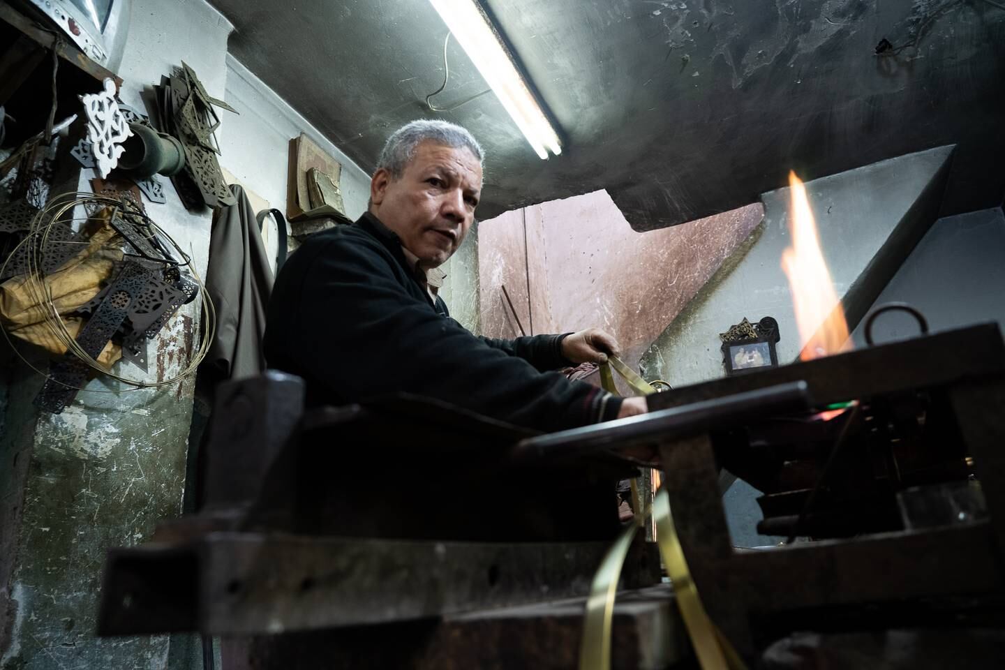 Copper artisan Ahmed Mattar, 65, owns and runs a small workshop in Islamic Cairo, which specialises in creating Ramadan lanterns. Mahmoud Nasr / The National