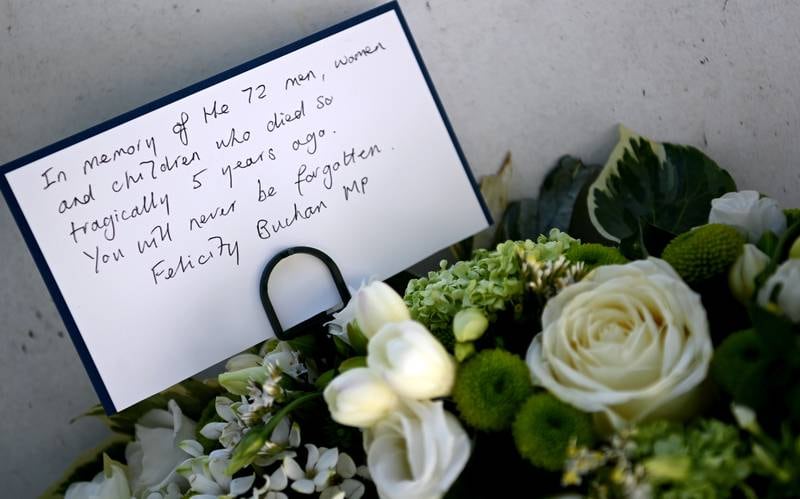 A message left at the Grenfell Tower Memorial Wall near the Grenfell Tower. EPA
