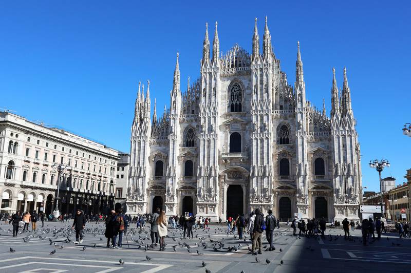MILAN, ITALY - FEBRUARY 28: Residents and tourists walk in a little more populated Duomo square despite the fear of most residents to leave their houses due to the Corona Virus on February 28, 2020 in Milan, Italy. Italy registered a 25% surge in coronavirus cases in 24 hours, with infections remaining centered on outbreaks in two northern regions, Lombardy and Veneto. But a few cases have turned up now in southern Italy too. In Italy so far 650 people have been infected and 17 have died, officials say, amid global efforts to stop the virus spreading. Italy's Foreign Minister Luigi Di Maio told reporters that an "infodemic" of misleading news abroad was damaging Italy's economy and reputation. Italy's tourism association Assoturismo says March accommodation bookings are down by at least 200m (Â£170m; $219m) because of the virus. Schools, universities, cinemas and Milans famous La Scala opera house have been closed and several public events cancelled. Eleven towns at the centre of the outbreak - home to a total of 55,000 people - have been quarantined. There are fears that the outbreak may tip Italy into economic recession. (Photo by Marco Di Lauro/Getty Images)