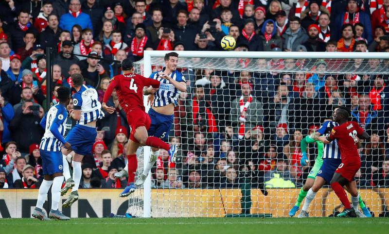 Liverpool's Virgil van Dijk heads in their second goal. Reuters