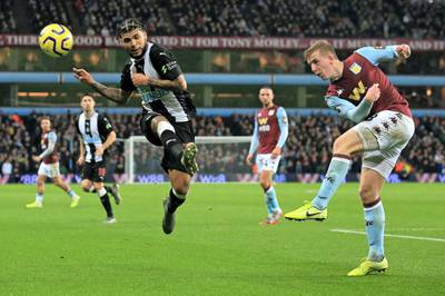Newcastle United's US defender DeAndre Yedlin (L) vies with Aston Villa's English defender Matt Targett during the English Premier League football match between Aston Villa and Newcastle United at Villa Park in Birmingham, central England on November 25, 2019. (Photo by Lindsey Parnaby / AFP) / RESTRICTED TO EDITORIAL USE. No use with unauthorized audio, video, data, fixture lists, club/league logos or 'live' services. Online in-match use limited to 120 images. An additional 40 images may be used in extra time. No video emulation. Social media in-match use limited to 120 images. An additional 40 images may be used in extra time. No use in betting publications, games or single club/league/player publications. / 
