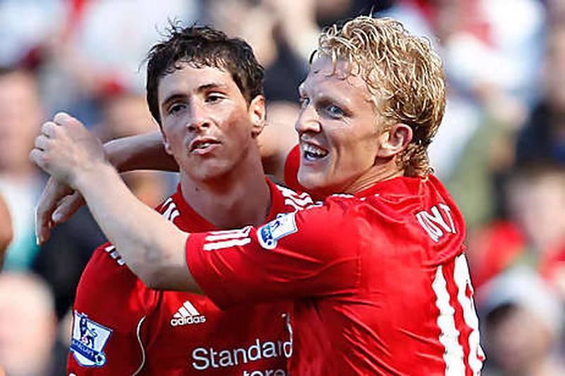 Fernando Torres, left, is congratulated by his Liverpool and teammate Dirk Kuyt after scoring the winner against West Brom.