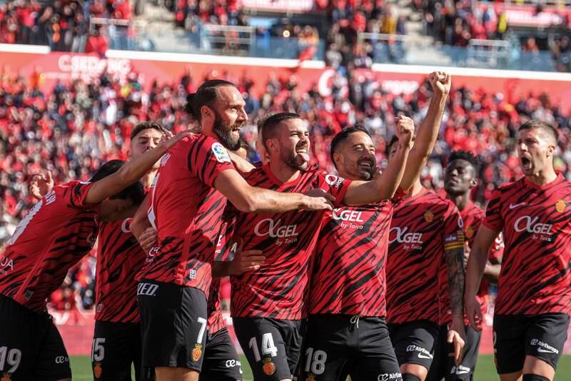 Mallorca's players celebrate after the only goal of the game. EPA