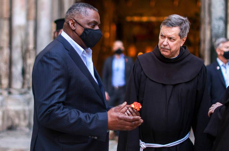 US Defence Secretary Lloyd Austin speaks with Franciscan monks outside the Church of the Holy Sepulchre in Jerusalem's Old City, during his visit to Jerusalem. AFP