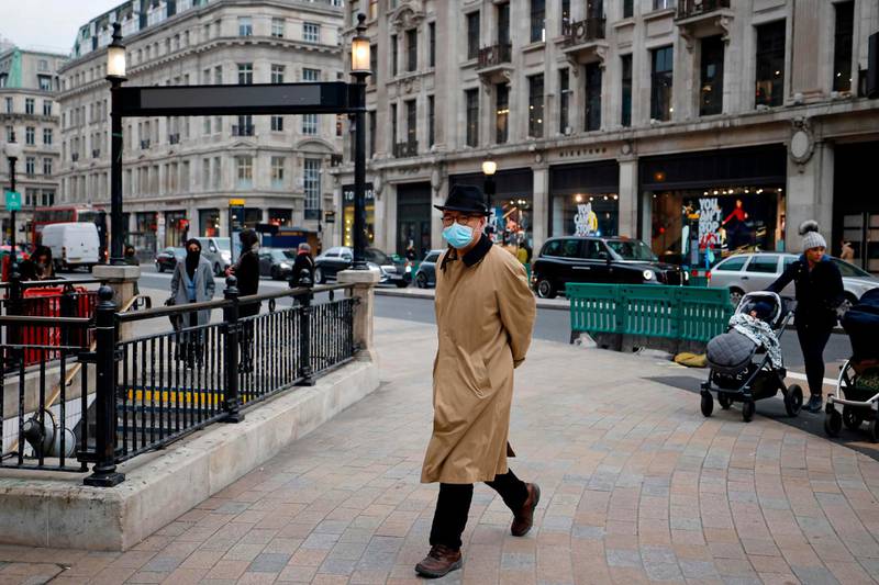 A amn crosses a quiet Oxford Circus in central London. AFP