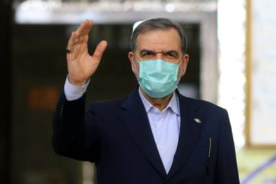Presidential candidate Mohsen Rezaee greets people at a polling station in Tehran, Iran. Reuters