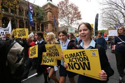 Climate activists march towards the New South Wales Parliament building in Sydney, Australia. Getty Images