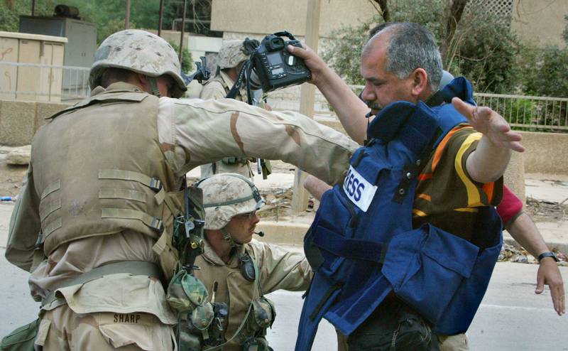 US Marines search Iraqi photographer Karim Sahib in Baghdad on April 10, 2003. Photo: AFP
