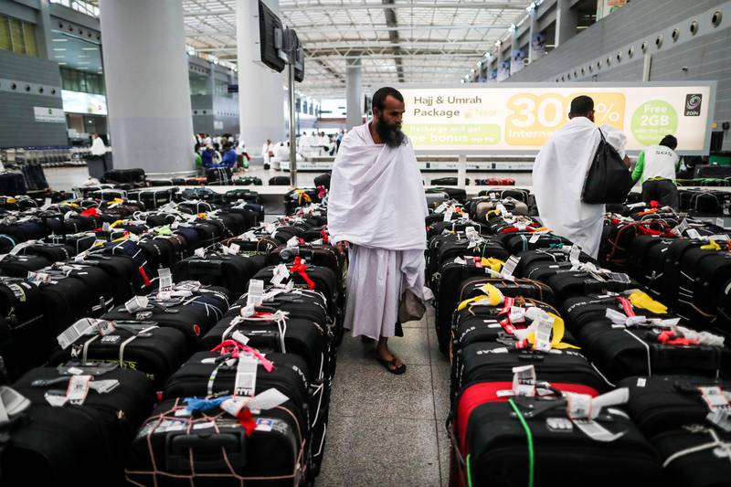 Muslim worshippers check their luggage at the Hajj terminal of the King Abdulaziz international airport in Jeddah, Saudi Arabia. Mast Irham / EPA