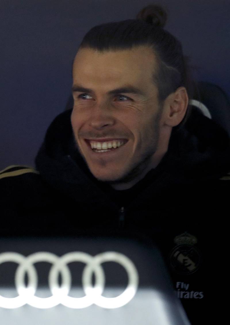 Real winger Gareth Bale seems to be happy on the bench before his late apperance at the Bernabeu. EPA