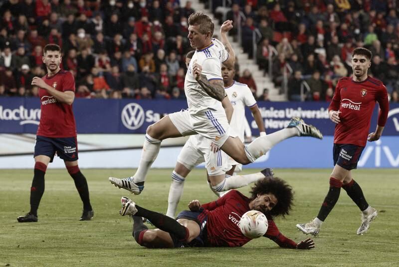 Real Madrid midfielder Toni Kross jumps over Osasuna's Aridane Hernadez. EPA