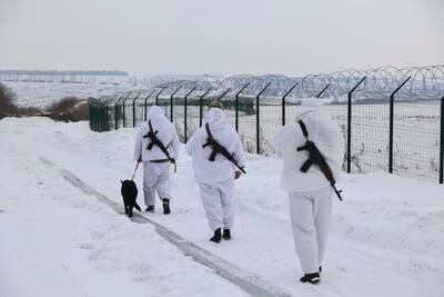 Ukrainian border guards patrol along the border with Russia, near Kharkiv. EPA